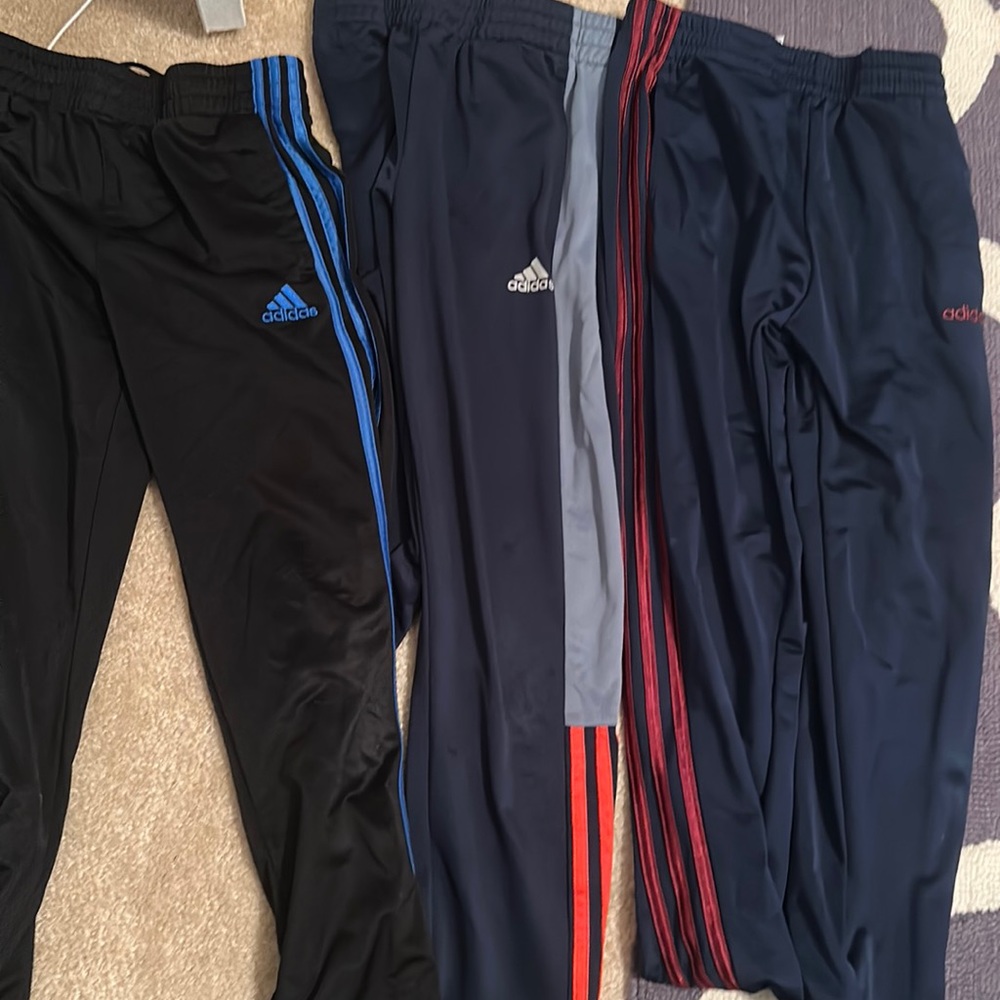 Three (3) Adidas sweatpants, M black/blue, black /crimson , black/grey & orange